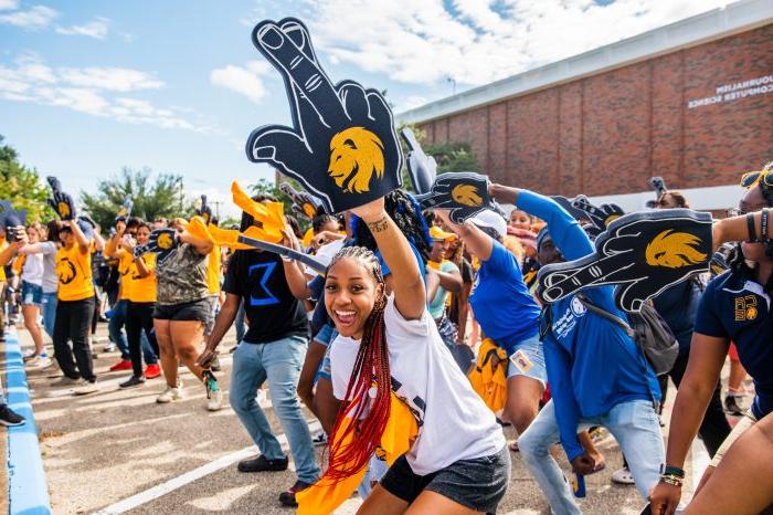 A group of students cheering for an event.